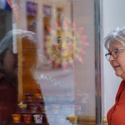 Older woman looking in a window
